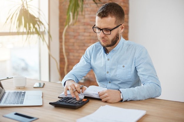Experienced Accountant Ashford preparing client financial reports