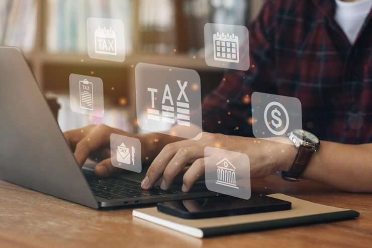 Man filing income tax return online on computer
