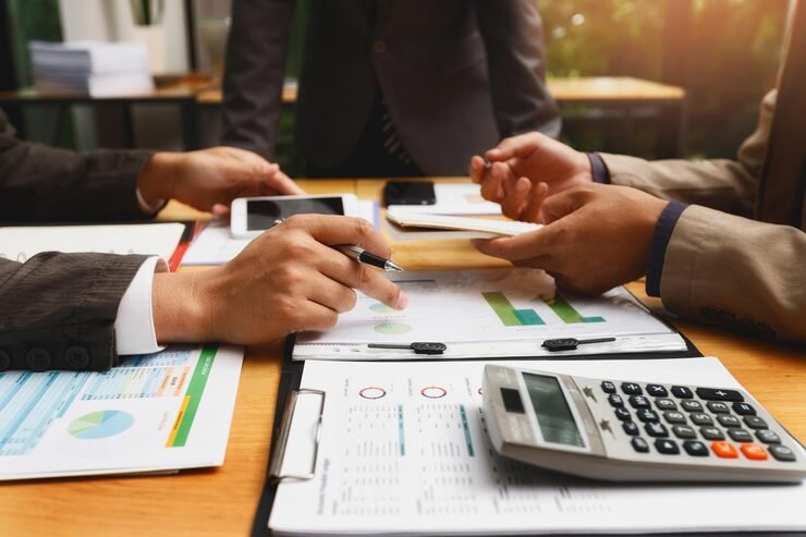 Businessman using smartphone for payroll and accounting tasks