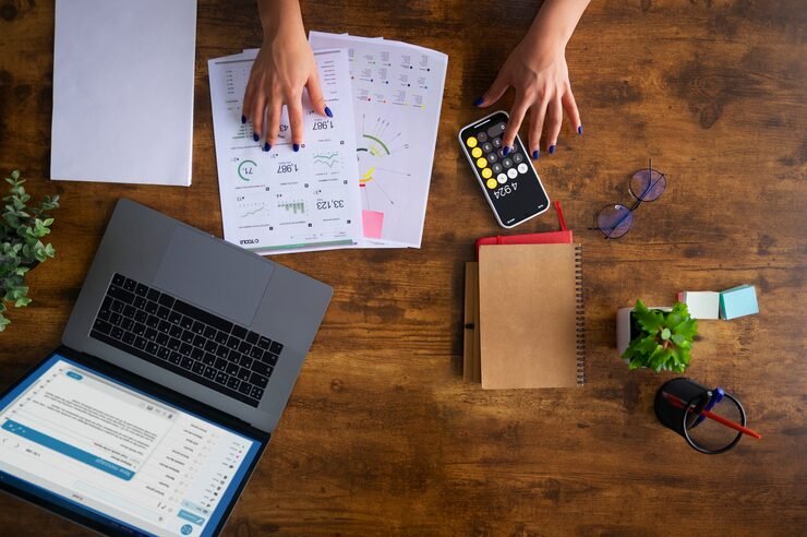 Woman preparing documents to file VAT return online for clients